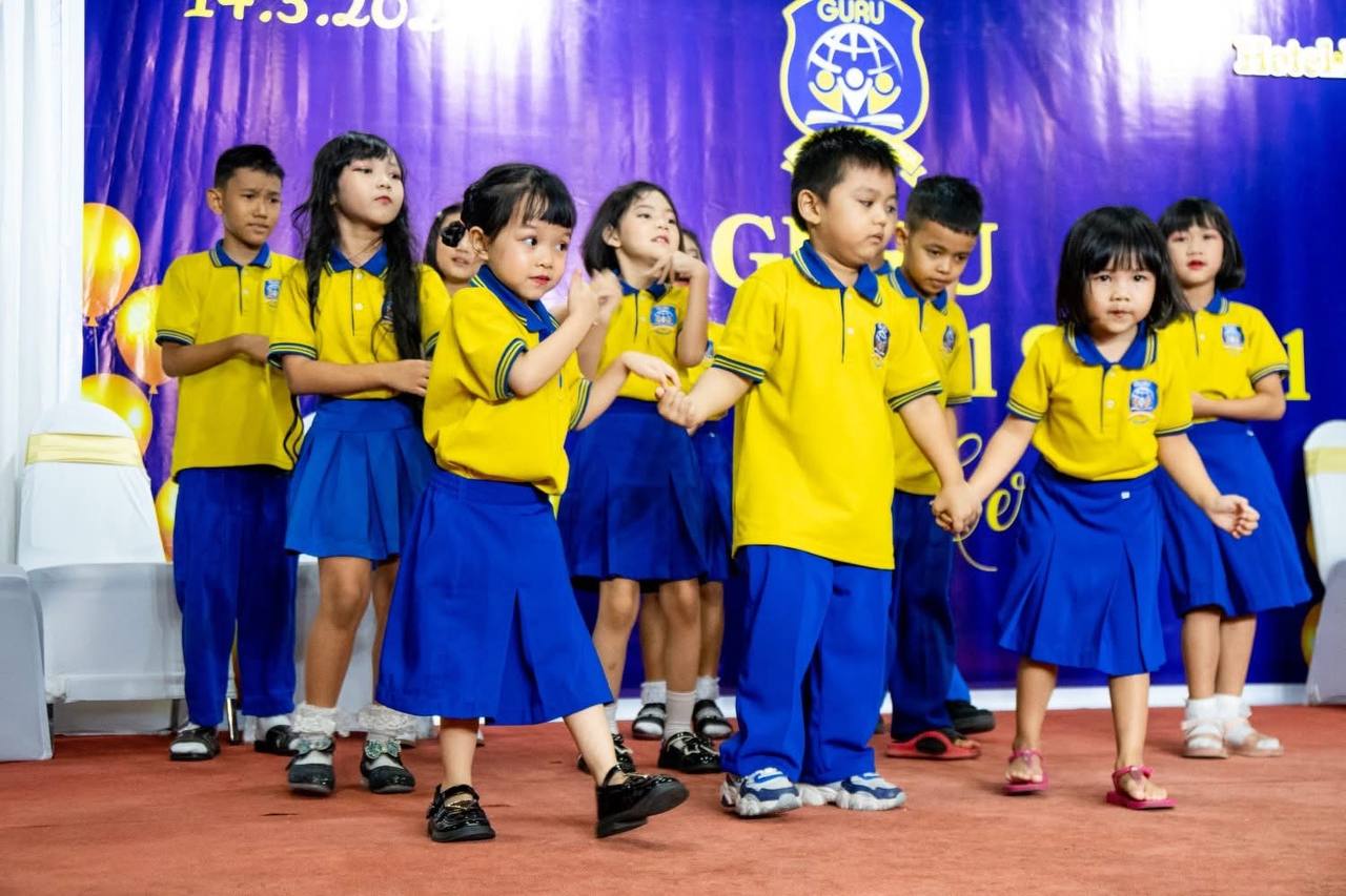 Guru students performing together at a school celebration